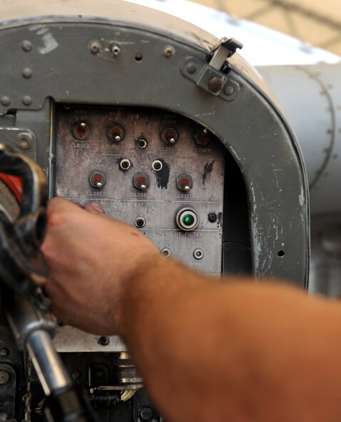 Senior Airman Andrew Brower, 74th Aircraft Maintenance Unit crew chief, flips switches during a refueling session at Moody Air Force base, Ga. April 11. The switches control the flow of fuel and what areas the fuel will be distributed to. (U.S. Air Force photo/Airman 1st Class Joshua Green)
