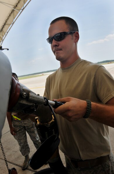 Senior Airman Andrew Brower, 74th Aircraft Maintenance Unit crew chief, hooks a fuel line up to an A-10C Thunderbolt II during a refueling session at Moody Air Force base, Ga. April 11. It takes between 1,000 to 1,200 gallons of fuel to refuel an A-10. On average, A-10s are refueled 25 to 100 times a week. (U.S. Air Force photo/Airman 1st Class Joshua Green)

