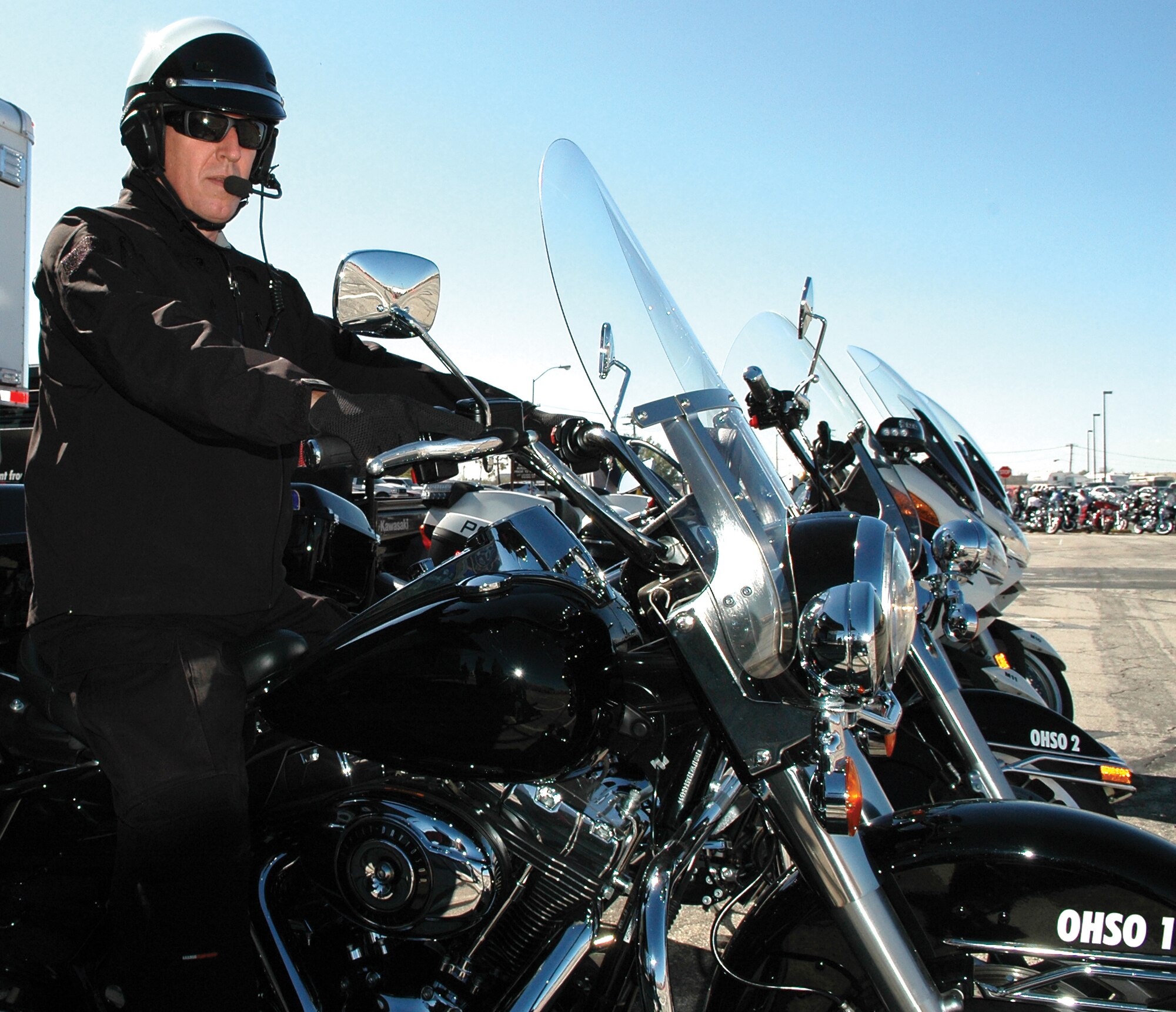 Edmond officer Jeff Meadows prepares for a motorcycle demonstration. Motorcycle officers from Midwest City, Edmond and the State Troopers were on hand to demonstrate riding techniques and talk with the riders about their bikes, equipment and safety. (Air Force photo by Micah Garbarino)