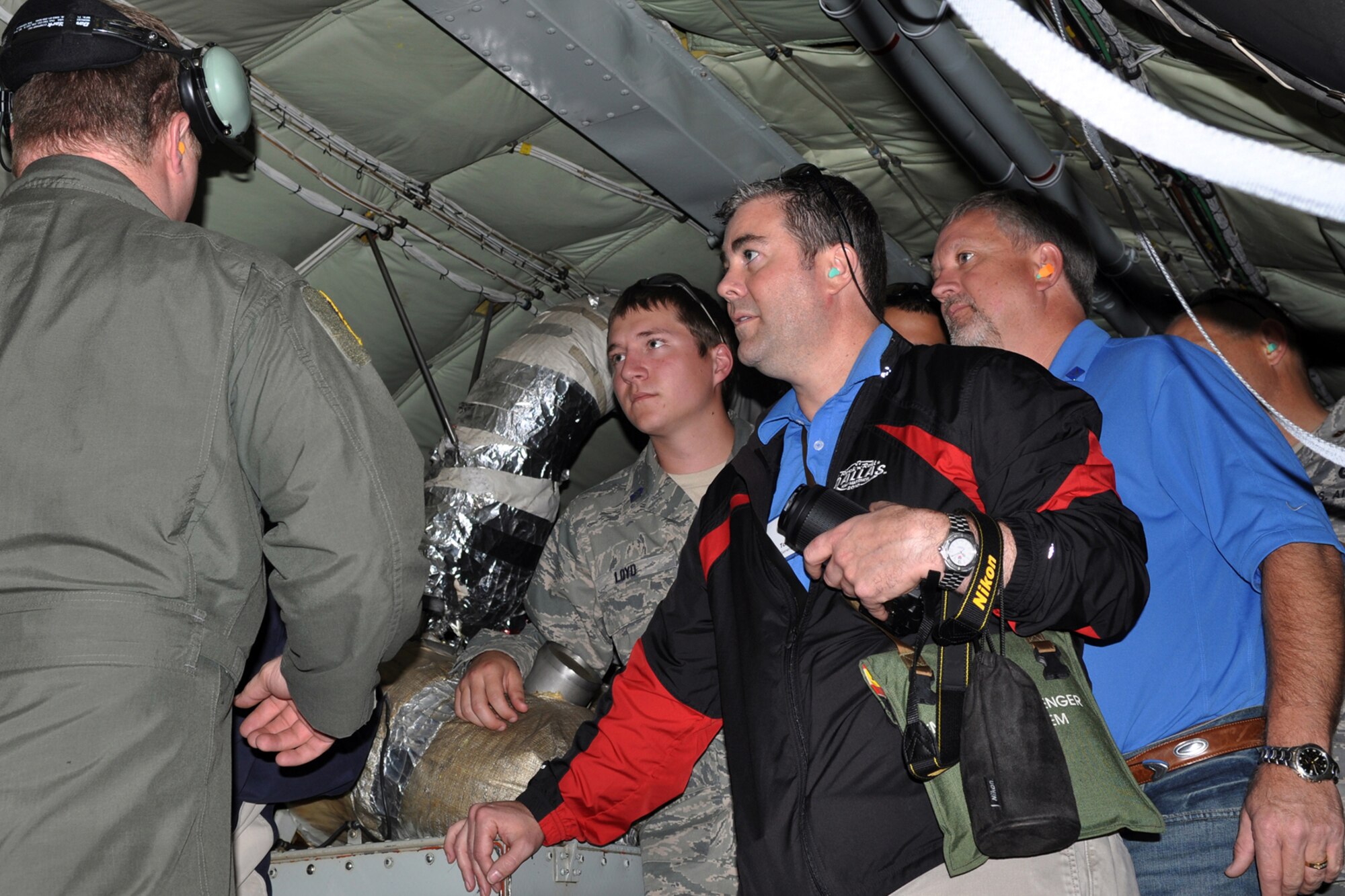 Jeffrey Buck and Tom Gray, employers of Reservists of the 307th Bomb Wing, Barksdale Air Force Base, La., listen as Tech. Sgt. Kenny Stewart, a boom operator with the 18th Air Refueling Wing at McConnell Air Force Base, Kan., explains the details of the refueling mission. The employers were invited to be part of the flight refueling A-10s and B-52s, followed by a briefing from the Employer Support of Guard and Reserve, during the wing's biennial Employer Appreciation flight. (U.S. Air Force photo/Master Sgt. Mary Hinson)