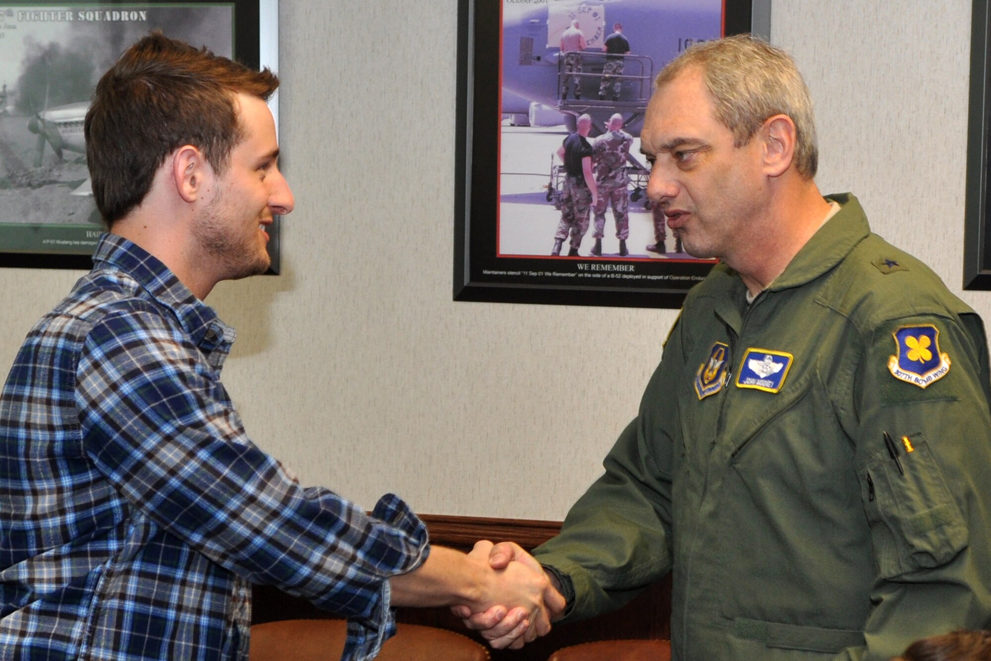 Brig. Gen. John J. Mooney III, commander, 307th Bomb Wing, greets Dustin Johnston in the commander’s conference room at the 307th BW headquarters building at Barksdale Air Force Base, La., April 1, 2011. Mr. Johnston, who is a Youth Pastor for the Central Assembly of God, Haughton, La., was part of Clergy Day at the 307th BW. The 307th BW showcased its mission capabilities over a four-day period for clergy members, local civic leaders as well as the employers of some the bomb wing’s Airmen during three back-to-back community support events March 30 – April 2, 2011. The clergy were given a wing tour, which included a windshield tour of the base. They were briefed on the B-52 Stratofortress and A-10 Thunderbolt II on the flightline before a mission briefing by General Mooney. Afterwards the clergy were treated to lunch and a briefing on military chaplain’s responsibilities by Lt. Col. Scott Adams, who is the 307th BW Chaplain. (U.S. Air Force photo/Tech. Sgt. Jeff Walston)