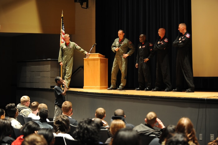 A student at Berkeley High School in Charleston, S.C., asks members of the F-15E Demonstration Team questions about their flying equipment during the team’s visit into the local community April 7.  The demo team represented the Air Force as they gave a presentation about equipment used and training received to help secure the Air Force’s air superiority.  The demo team also participated in the 2011 Air Expo at Joint Base Charleston, S.C., April 9.  (U.S. Air Force photo/Tech. Sgt. Chrissy Best)