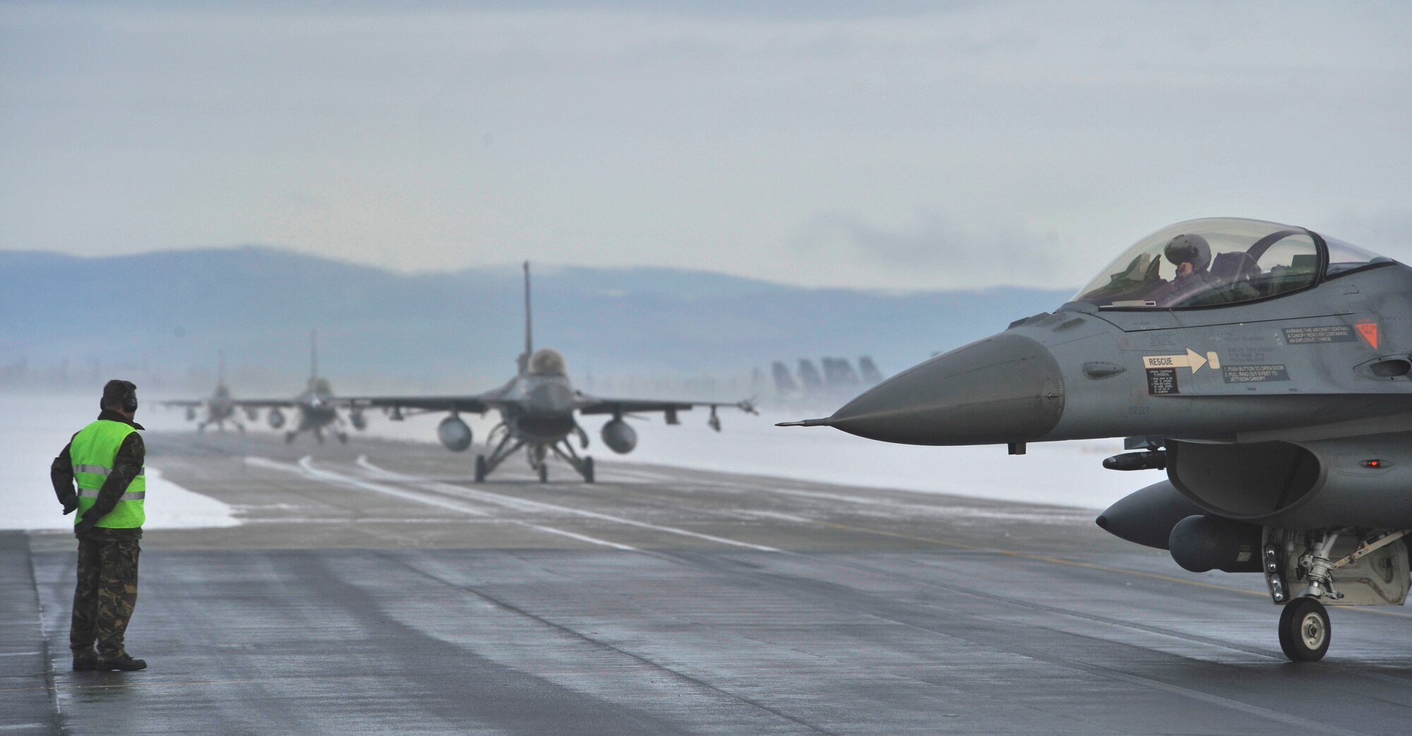 F-16A's from the Royal Netherlands air force taxi to the runway at Eielson Air Force Base, Alaska, April 8, 2011. It is the first time the RNLAF will participate in exercises DISTANT FRONTIER and RED FLAG-Alaska. (U.S. Air Force photo/Staff Sgt. Christopher Boitz)