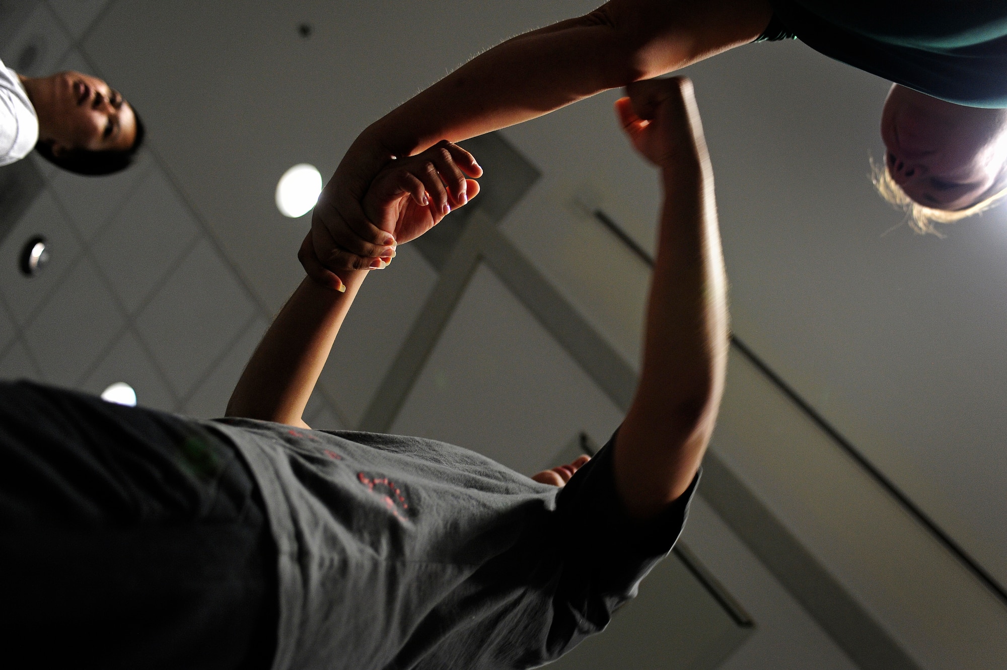 U.S. Air Force Staff Sgt. Lynette Bell, 39th Intelligence Operations Squadron, and Tech. Sgt. Mandy Johnson, 14th Weapons Squadron, practice breaking out of a wrist grab during a self-defense class, Hurlburt Field, Fla., April 5, 2011. The self-defense class enables a person with no martial arts experience to learn basic moves to combat sexual assault. (U.S. Air Force photo by Staff Sgt. Julianne M. Showalter/ Released)
