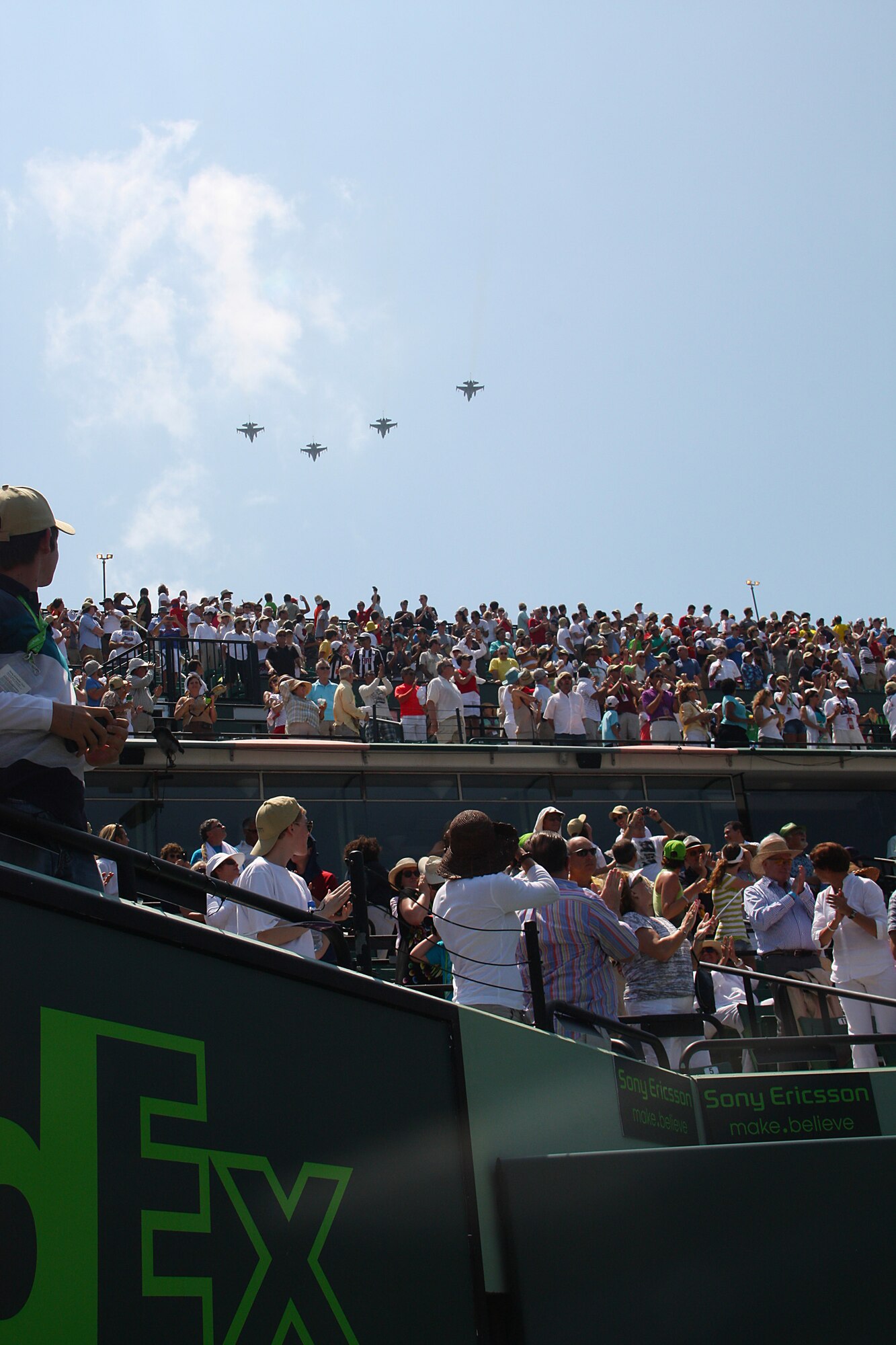 At the ending note of the national anthem, the 93rd Fighter Squadron provided a well timed flyover of four F-16's. The ceremony, televised to millions of viewers, enthralled a crowd of 14,000 people.  As the fifth largest tennis tournament in the world, the Sony Ericsson Open showcases the top worlds men's and women's professional tennis players within the beautiful grounds of the Tennis Center at Crandon Park. (U.S. Air Force Photo by Senior Airman Lou Burton, 482nd Fighter Wing Public Affairs)