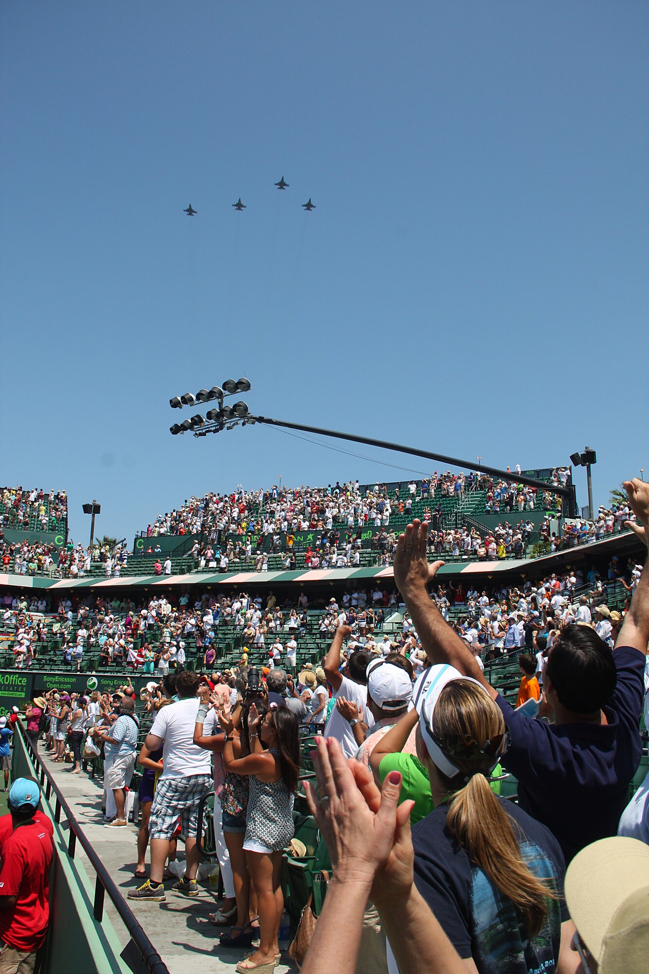 At the ending note of the national anthem, the 93rd Fighter Squadron provided a well timed flyover of four F-16's. (U.S. Air Force Photo by Senior Airman Lou Burton, 482nd Fighter Wing Public Affairs)