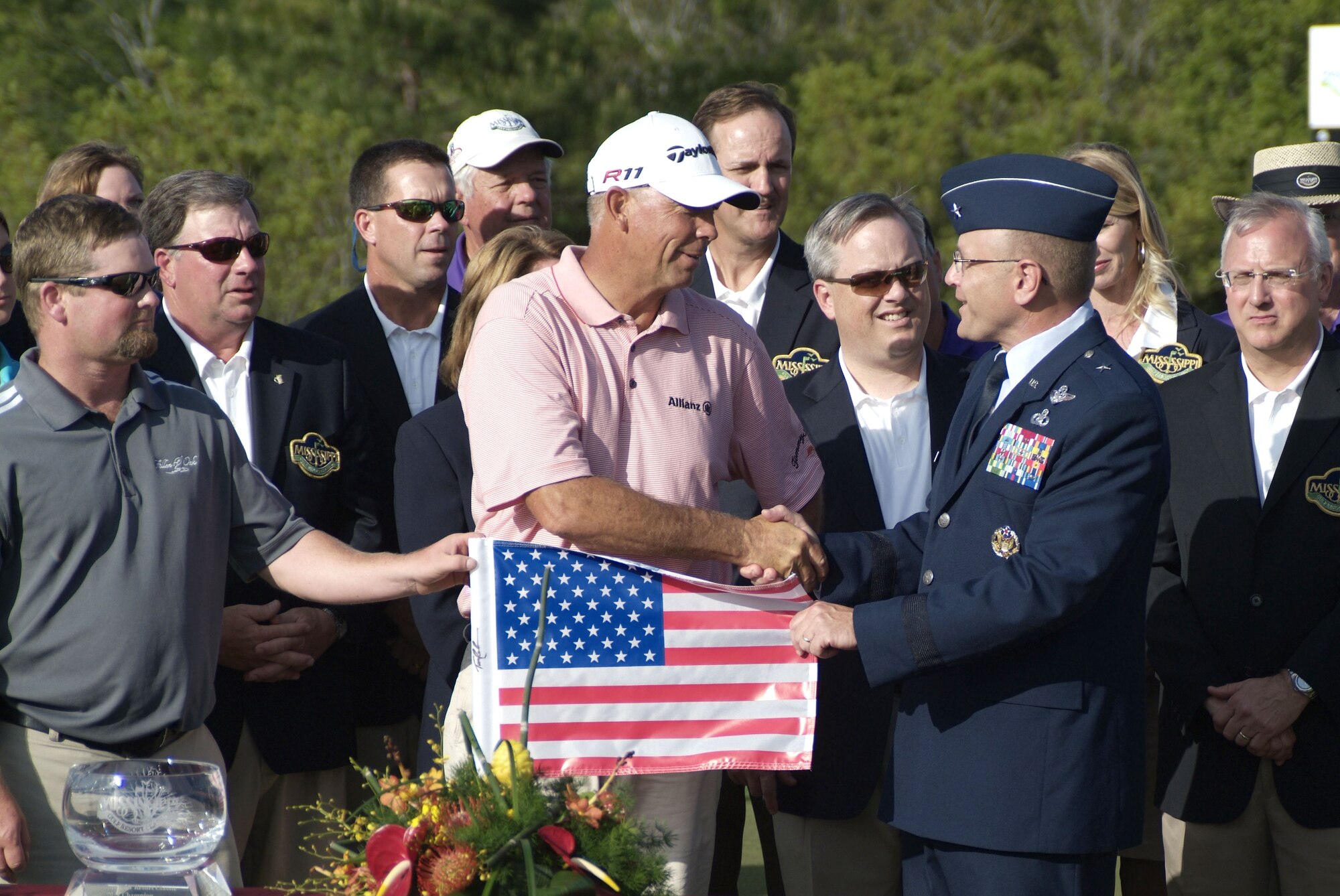 Brig. Gen. Andrew Mueller, 81st Training Wing commander, congratulates Tom
Lehman, winner of the Mississippi Gulf Resort Classic. The Hole 18 flag was presented
to the general at the conclusion of the tournament, Sunday.  (U.S. Air Force photo by Jamey Foster)