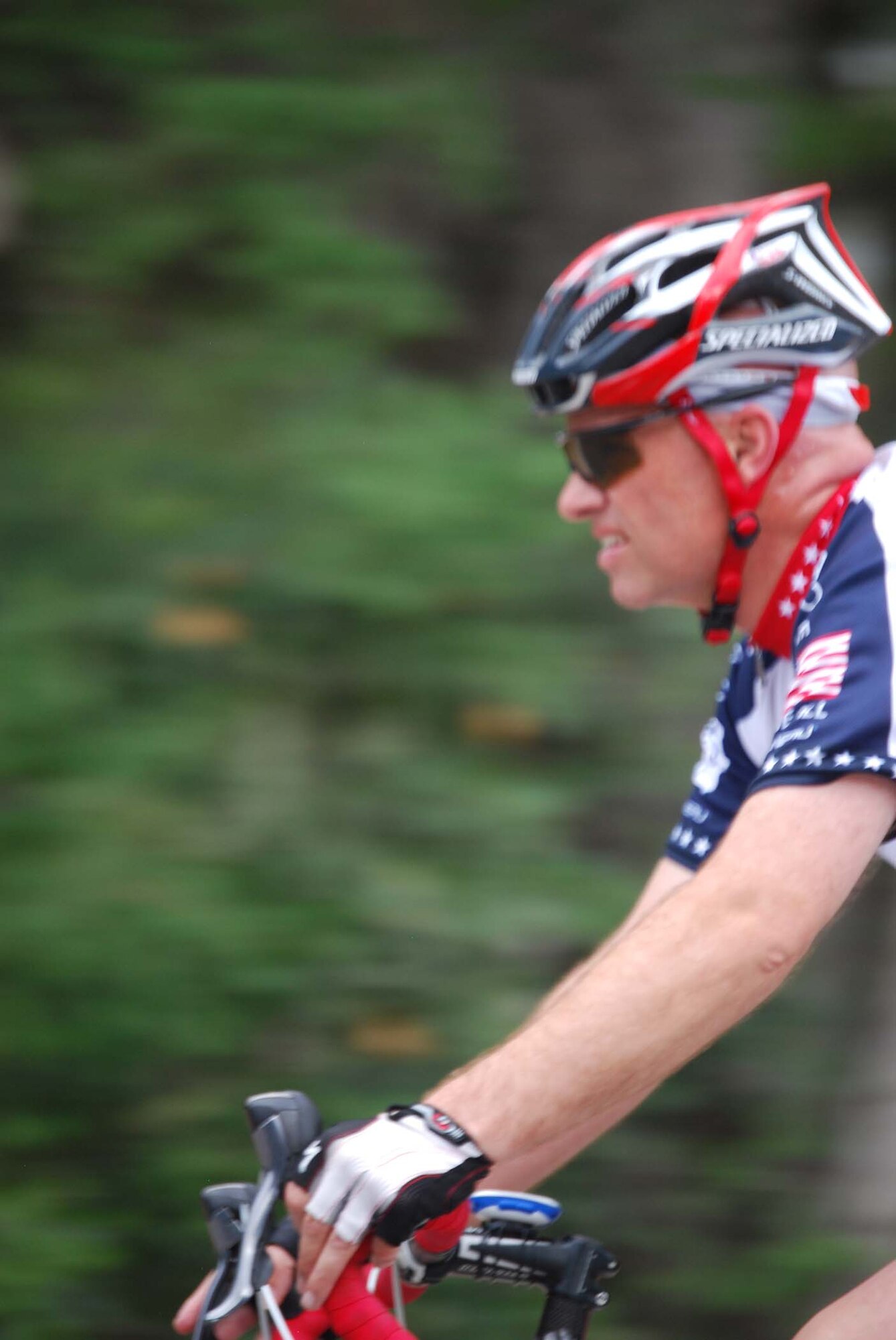 Captain C. Scott Lawrence, a 433rd Executive Officer, focuses on the road ahead as he approaches a curve during the Fiesta Wildflower 100K Bike Ride. Captain Lawrence was part of a 24-man Air Force team which was comprised of Reserve and active duty Airmen from Lackland and Randolph Air Force Bases. (U.S. Air Force photo/Senior Airman Viola M. Hernandez)