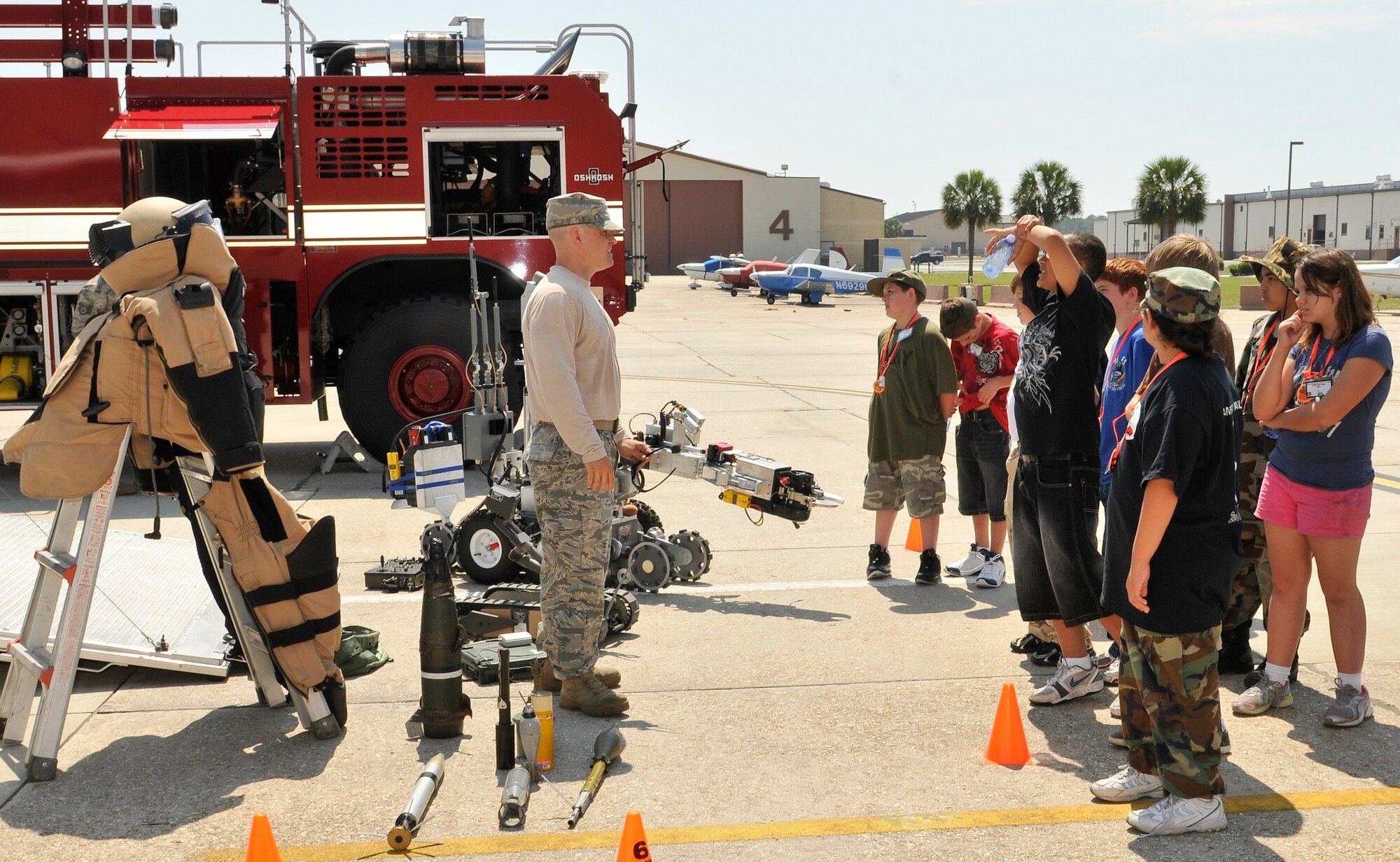 Team Tyndall dependents recieve a brief on Explosive Ordnance Disposal April 9 during the JR RAPTOR program. (U.S. Air Force photo by Lisa Norman)