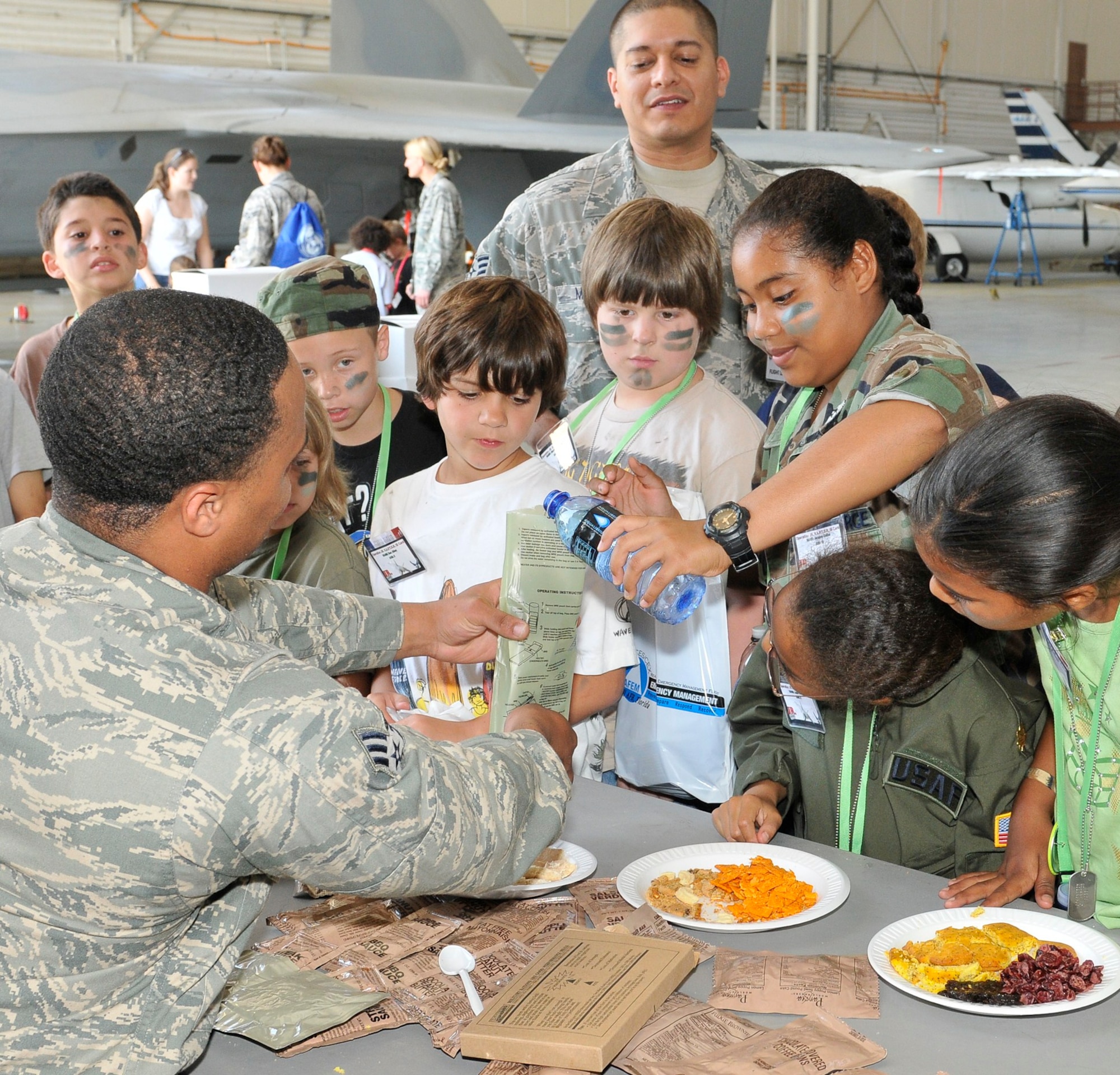 Team Tyndall dependents learn how to warm up a Meals, Ready to Eat, April 9 during the JR RAPTOR program. (U.S. Air Force photo by Lisa Norman)