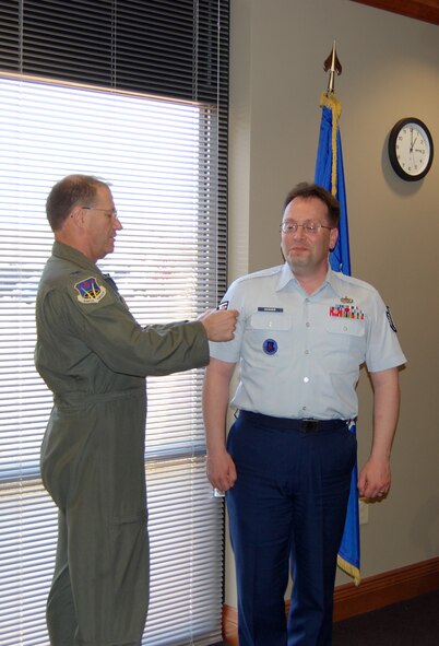 NELLIS AIR FORCE BASE, Nev. -- (Right) Tech. Sgt. Franklin Warner, 926th Group recruiter, is pinned on by Col. Herman Brunke, Jr., 926th Group commander, during a ceremony here March 31. (U.S. Air Force photo/Capt. Jessica Martin)
