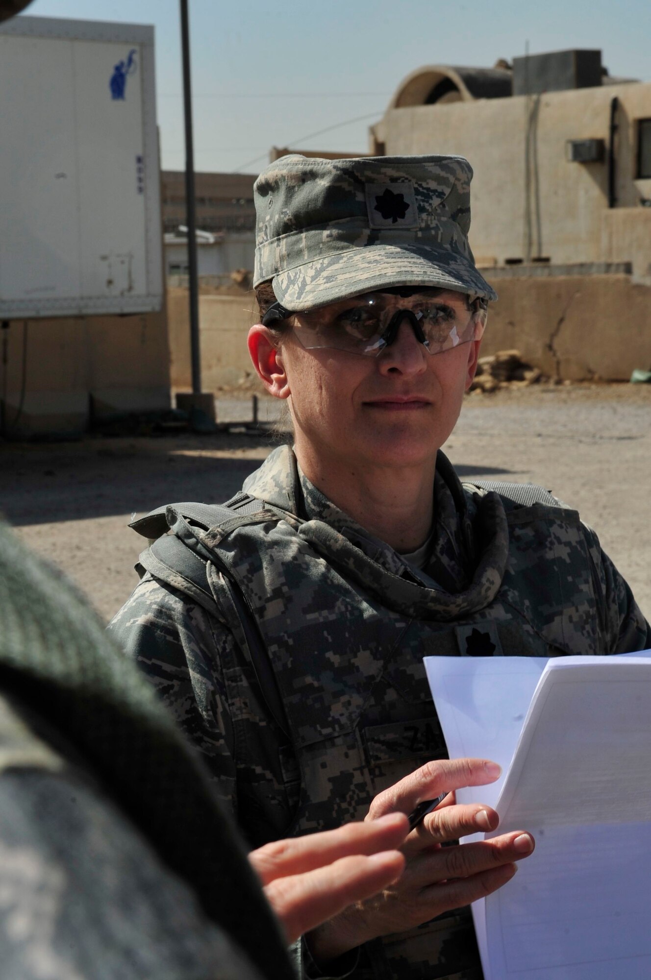 U.S. Air Force Lt. Col. Kaylin Haywood Zapata, Edmond, Okla., native and an Iraq Training and Advisory Mission – Police oil and electric police advisor, reviews a checklist before she joins the corrections assistance transition team for a mission leaving Joint Security Station Shield, Iraq, April 6, 2011. She is helping assess the conditions at a women’s prison in Baghdad’s Rusafa District. Colonel Haywood Zapata has a list of questions she will ask the warden at the facility. (U.S. Air Force photo by Senior Master Sgt. Larry A. Schneck/Released)