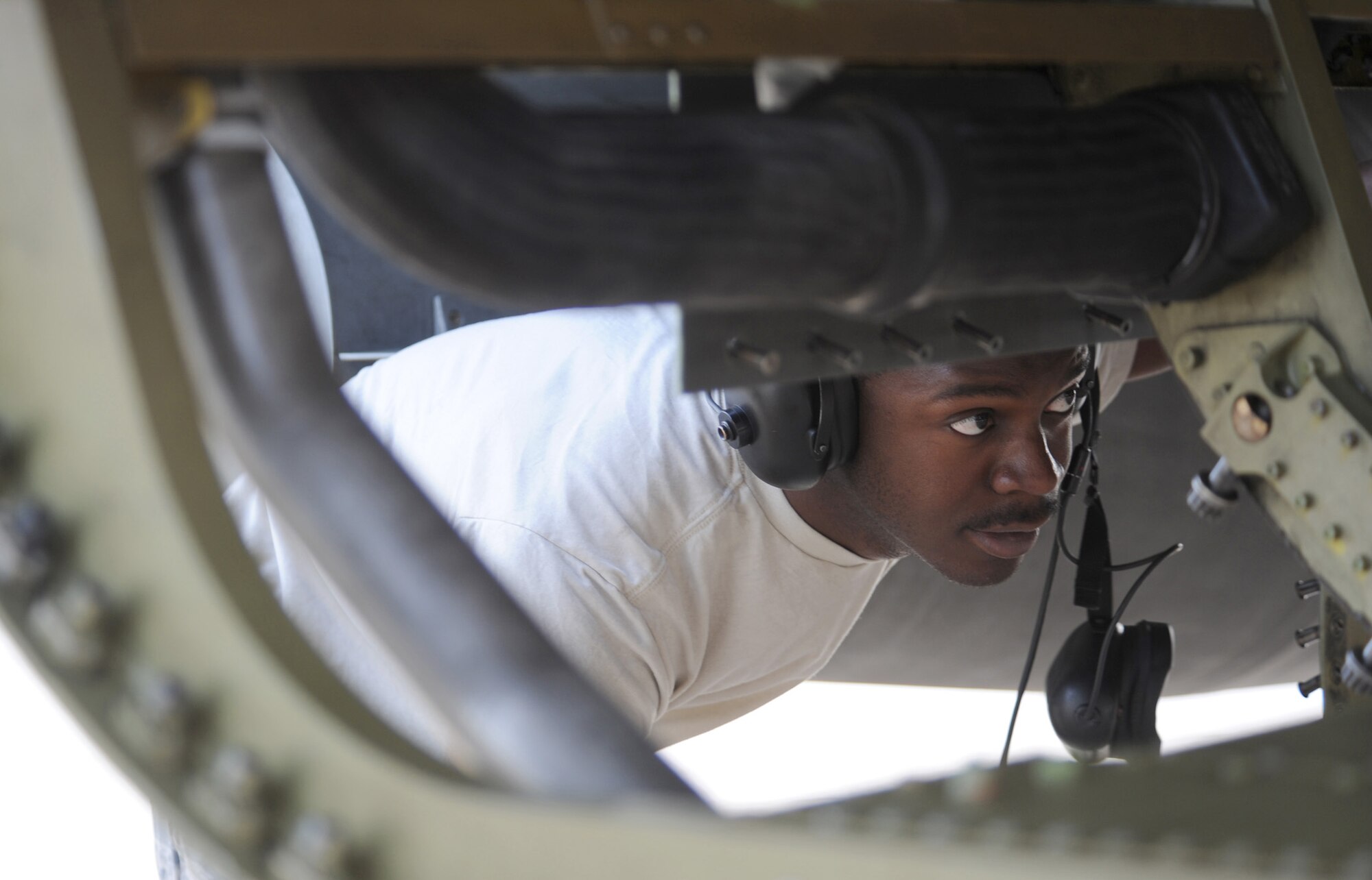Staff Sgt. Kemp Roderick inspects an F-16 Fighting Falcon engine compartment March 31, 2011, at Aviano Air Base, Italy. Sergeant Roderick is assigned to the 52nd Aircraft Maintenance Squadron, which deployed from Spangdahlem Air Base, Germany, in support of Odyssey Dawn. (U.S. Air Force photo/Staff Sgt. Nadine Y. Barclay)