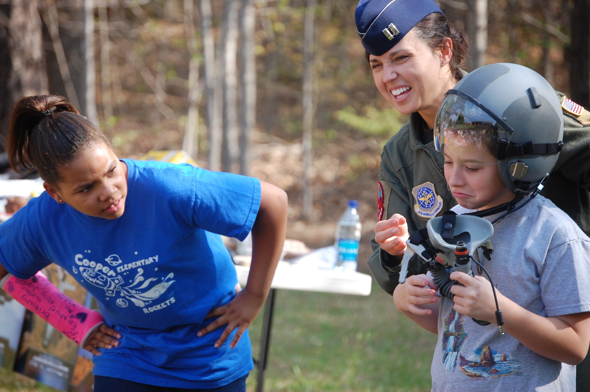 So maybe being a pilot isn't all that great. Capt. Jessica Guarini helps a young student out of her flight helmet during a demonstration at Cooper Elementary's Community Day. (USAF photo by Maj. Shannon Mann, 916ARW/PA)