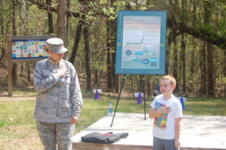 A student at Cooper Elementary recites the Pledge of Allegiance during the school's community day. Students were asked current event questions and civic questions in order to try on the gear that 916th Airmen brought with them. (USAF photo by Capt. Jessica Guarini, 911ARS)