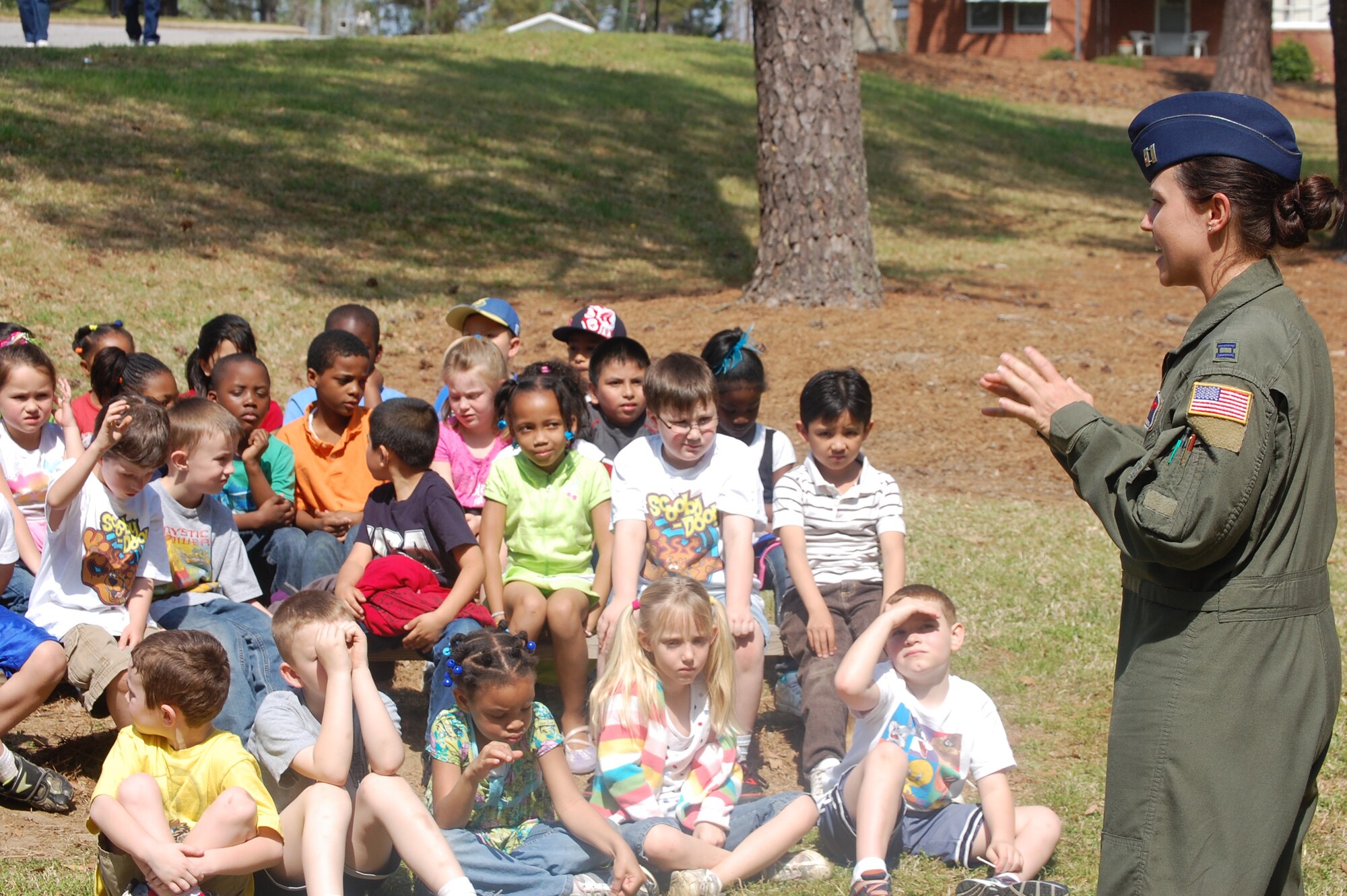 Capt. Jessica Guarini, 911th Air Refueling Squadron pilot, talks to a group of students during Cooper Elementary's Community Day. (USAF photo by Maj. Shannon Mann, 916ARW/PA)