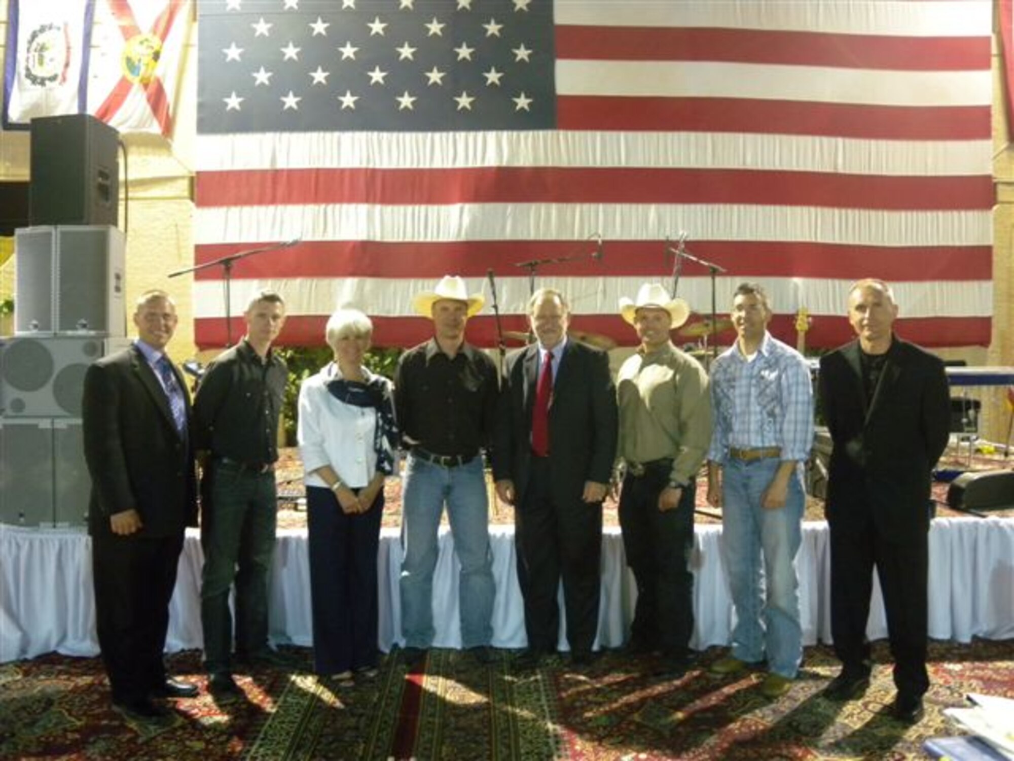 AFCENT Band Wild Blue Country members with U.S. Ambassador to the Kingdom of Saudi Arabia, Air Force Brigadier General (Retired) Mr. James Smith and his wife Dr. Breslin-Smith after the National Day Celebration which hosted over 1,000 dignitaries from around the world. (U.S. Air Force photo by Master Sgt. Karl Bradley)