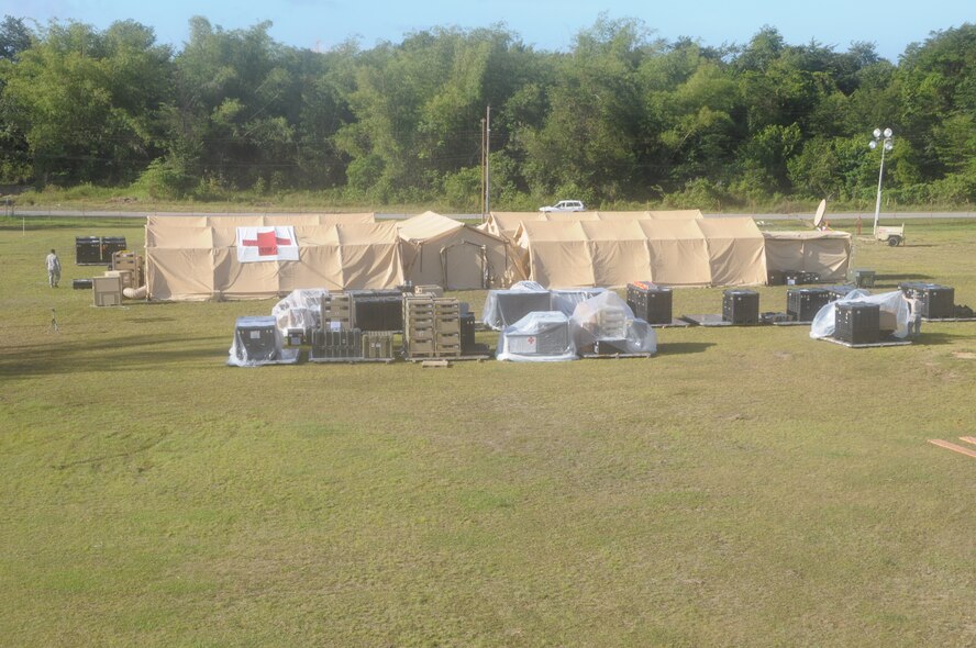 U.S. Air Force medical Airmen complete the set up of an expeditionary medical support health response team, or EMEDS HRT, facility at Cumuto Barracks, Trinidad and Tobago, on April 10, 2011. The EMEDS HRT participated in Fuerzas Alidas Humanitarias (FA HUM) 2011 or Allied Forces Humanitarian Exercise. (U.S. Air Force Photo/2nd Lt. Joel Banjo-Johnson) 