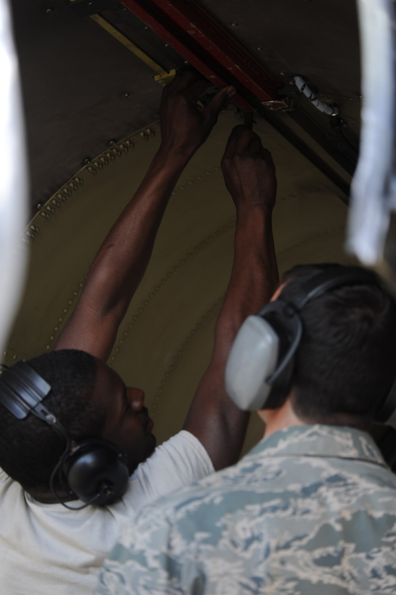 Staff Sgt. Kemp Roderick, 52nd Aircraft Maintenance Squadron, inspects F-16 Fighting Falcon engine compartment, March 31, 2011, at Aviano Air Base, Italy. Sergeant Roderick deployed to Aviano Air Base, Italy, from Spangdahlem Air Base, Germany in support of Operation Odyssey Dawn, now Operation Unified Protector for the enforcement of UNSCRs 1970 and 1973.(U.S. Air Force photo/ Staff Sgt. Nadine Y. Barclay)