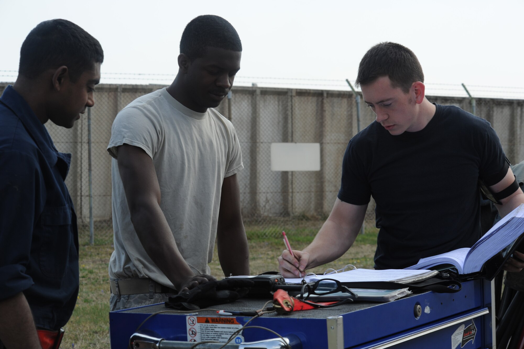 Airmen assigned to the 52nd Aircraft Maintenance Squadron, annotate F-16 Fighting Falcon maintenance March 31, 2011, at Aviano Air Base, Italy. The 52nd AMXS deployed to Aviano AB from Spangdahlem Air Base, Germany, in support of Operation Odyssey Dawn, now Operation Unified Protector, for the enforcement of UNSCRs 1970 and 1973. (U.S. Air Force photo/ Staff Sgt. Nadine Y. Barclay)