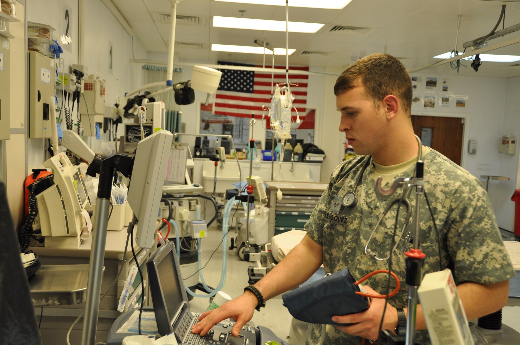 Airman 1st Class Adrian Velasquez, 60th Medical Operations Squadron aerospace medical technician, checks the status of the medical equipment in the trauma bay of the emergency room Apr 9. The trauma bay must be kept at a higher temperature of 95 to 102 degrees to help medical technicians treat patients for shock.
