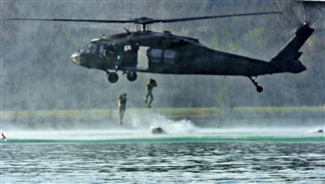 U.S. Army engineers or "sappers" jump from a hovering UH-60 Black Hawk helicopter during the helocast event on day one of the Best Sapper Competition at Fort Leonard Wood, Mo., on April 7, 2011.  