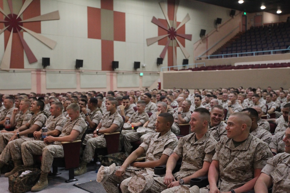 Marines laugh at the exaggerated stereotypes played by Kyle Terry and Judith Lesser, both actors with Sex Signals, during a sexual assault awareness brief at the Combat Center Sunset Cinema April 12, 2011.::r::::n::