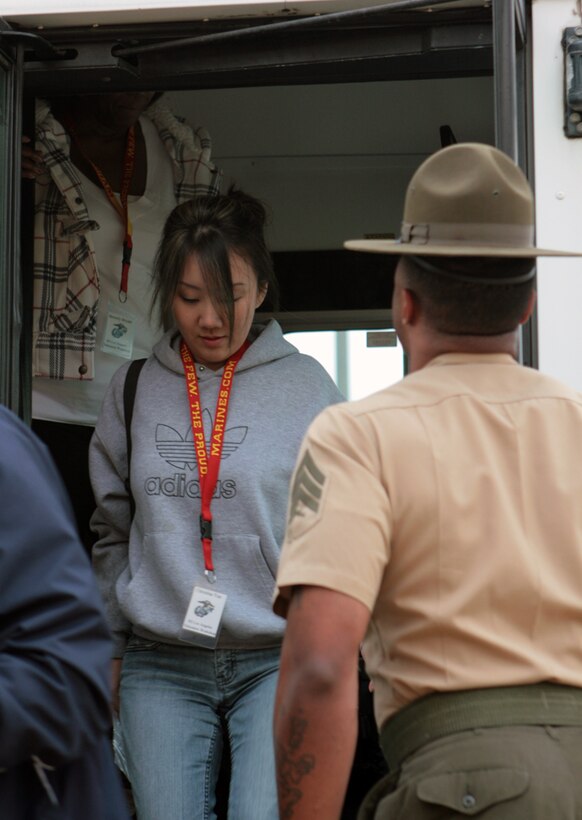 Christina Yun, a counselor at Buena High School, follows the simple command of "Get off my bus!" given by Marine Corps drill instructor as she participates in the first day of the Educators Workshop at Marine Corps Recruit Depot San Diego. Teachers from Recruiting Stations Los Angeles and Seattle's area came to MCRD San Diego April 12 to learn what Marine Corps recruits experience when they begin recruit training.