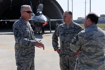 KUNSAN AIR BASE, Republic of Korea -- Chief Master Sgt. Brooke McLean, Pacific Air Forces command chief, speaks with Chief Master Sgt. James Smith, 8th Maintenance Group chief, and the 8th Fighter Wing command chief, Chief Master Sgt. James Sanders, during a visit here April 11. Chief McLean also visited Osan Air Base while on his trip to Korea. (U.S. Air Force photo/Tech. Sgt. Jonathan Pomeroy) 