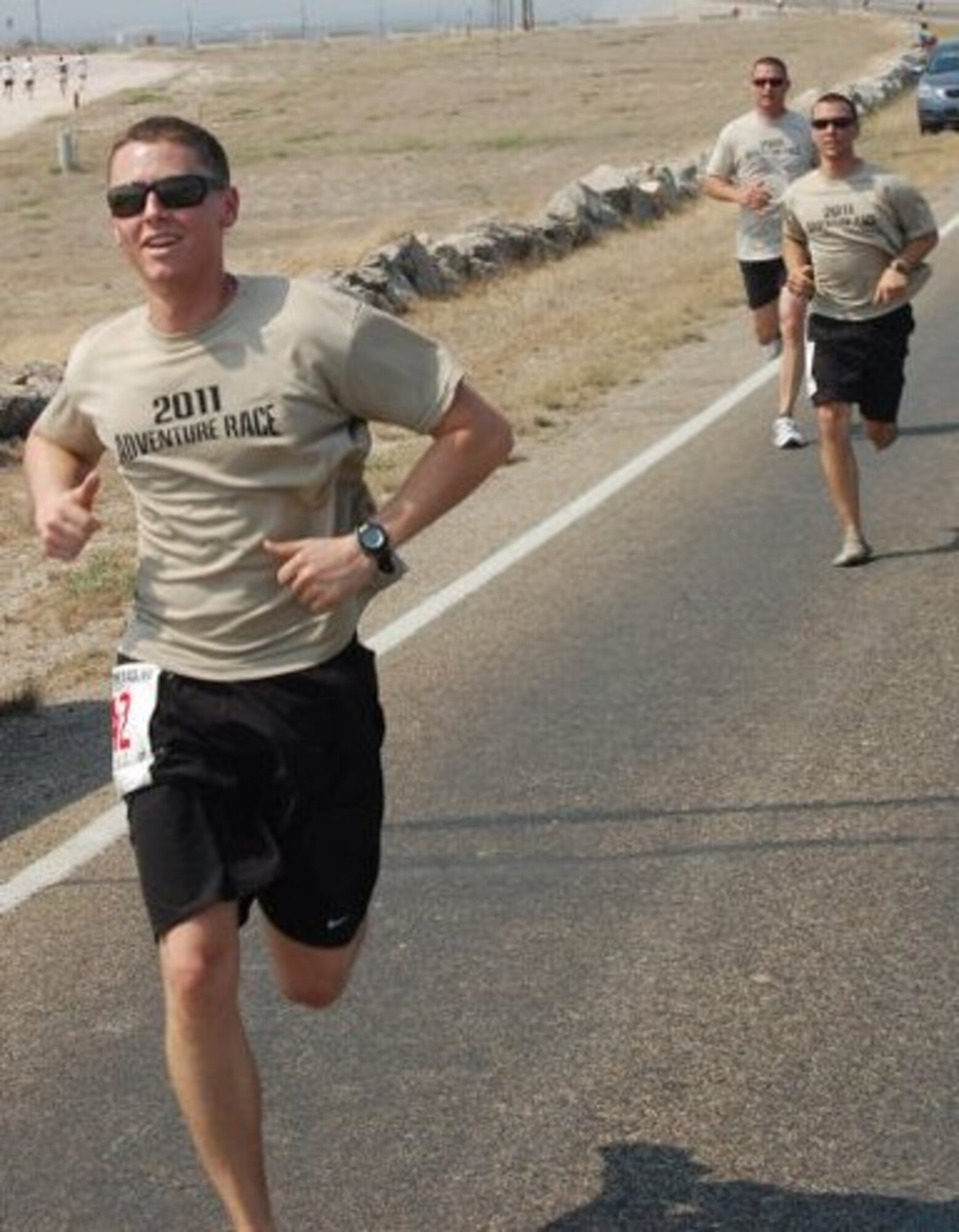 LAUGHLIN AIR FORCE BASE, Texas – Second Lt. Samuel Weir and 2nd Lt. Alex Emley, both of the 47th Flying Training Wing command post, and Chief Master Sgt. Ray DeVite, 47th FTW command chief, participate in the seventh edition of Laughlin’s Adventure Race here April 9. The race included almost 35 miles of biking and 7 miles of running. The winning team completed the course in around 2 hours and 22 minutes. (U.S. Air Force photo by Joel Langton)