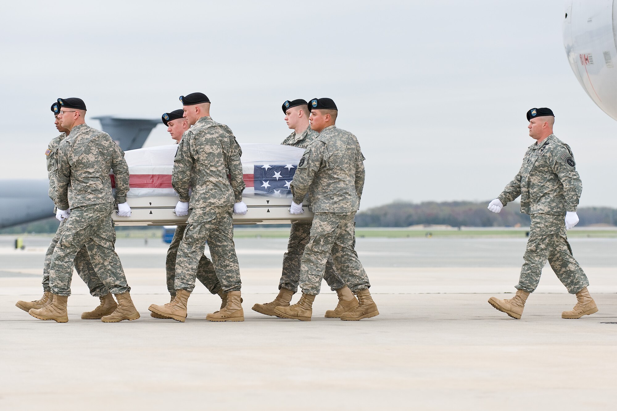A U.S. Army carry team transfers the remains of Army Staff Sgt. Jose M. Caraballo Pietri, of Yauco, Puerto Rico, at Dover Air Force Base, Del., April 12, 2011. Caraballo Pietri was assigned to the 1st Battalion, 84th Field Artillery Regiment, 170th Infantry Brigade Combat Team, Baumholder, Germany. (U.S. Air Force photo/Roland Balik)