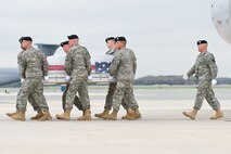A U.S. Army carry team transfers the remains of Army Staff Sgt. Jose M. Caraballo Pietri, of Yauco, Puerto Rico, at Dover Air Force Base, Del., April 12, 2011. Caraballo Pietri was assigned to the 1st Battalion, 84th Field Artillery Regiment, 170th Infantry Brigade Combat Team, Baumholder, Germany. (U.S. Air Force photo/Roland Balik)