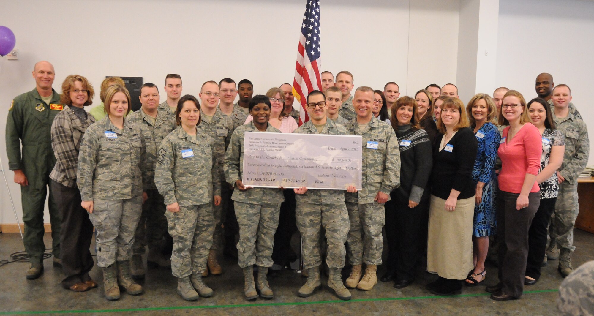 Icemen pose for a group photo during the  Volunteer Appreciation Luncheon April 7, 2011, Eielson Air Force Base, Alaska. Airmen, spouses and Department of Defense civilians were awarded with certificates by the Presidential Volunteer Service Award program for their contributions to the community in 2010. Each of the individuals recognized at the luncheon had more than 100 hours logged with the Airman and Family Readiness Center. (U.S. Air Force photo/Senior Airman Rachelle Coleman)