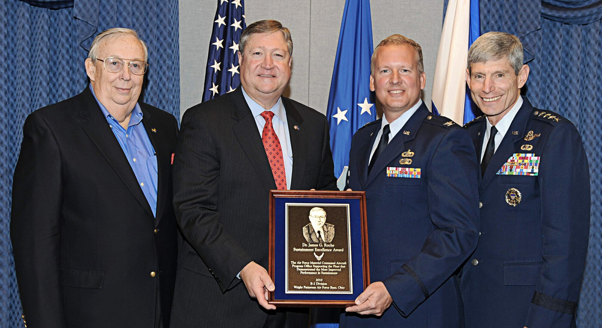 From left, former Secretary of the Air Force Dr. James G. Roche; current Secretary of the Air Force Michael B. Donley; Col. Mark Williams, Chief of the
B-2 Division at Wright-Patterson Air Force Base, Ohio; and Air Force Chief of Staff Gen. Norton Schwartz pose for a photograph following the 2010 Dr. James G. Roche Sustainment Excellence Award ceremony at the Pentagon on April 11, 2011.  Colonel Williams represented all the members of the B-2 Spirit division, which won the award for demonstrating the most improved performance in aircraft maintenance and logistics readiness.  (U.S. Air Force photo/Andy Morataya)
