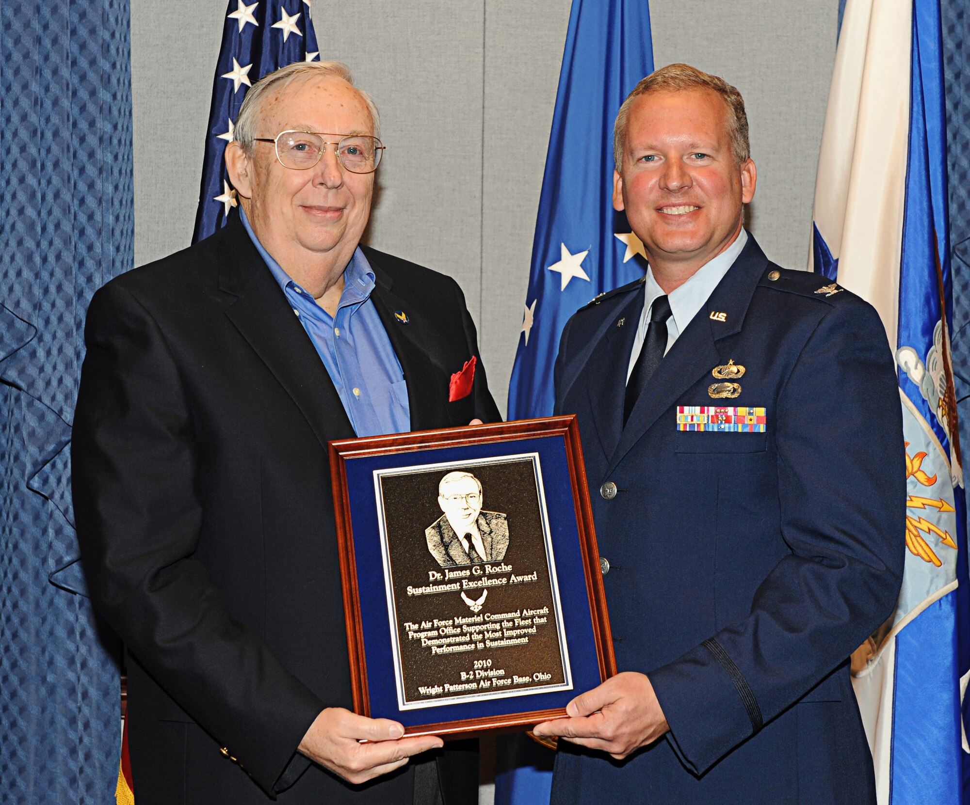 Dr. James G. Roche, former Secretary of the Air Force, poses for a photograph with Col. Mark Williams, Chief of the B-2 Division at Wright-Patterson Air Force Base, Ohio, during an award ceremony in the Pentagon April 11, 2011. Colonel Williams represented all the members of the B-2 Spirit division, which won the 2010 Dr. James G. Roche Sustainment Excellence Award for demonstrating the most improved performance in aircraft maintenance and logistics readiness. (U.S. Air Force photo/Andy Morataya)
