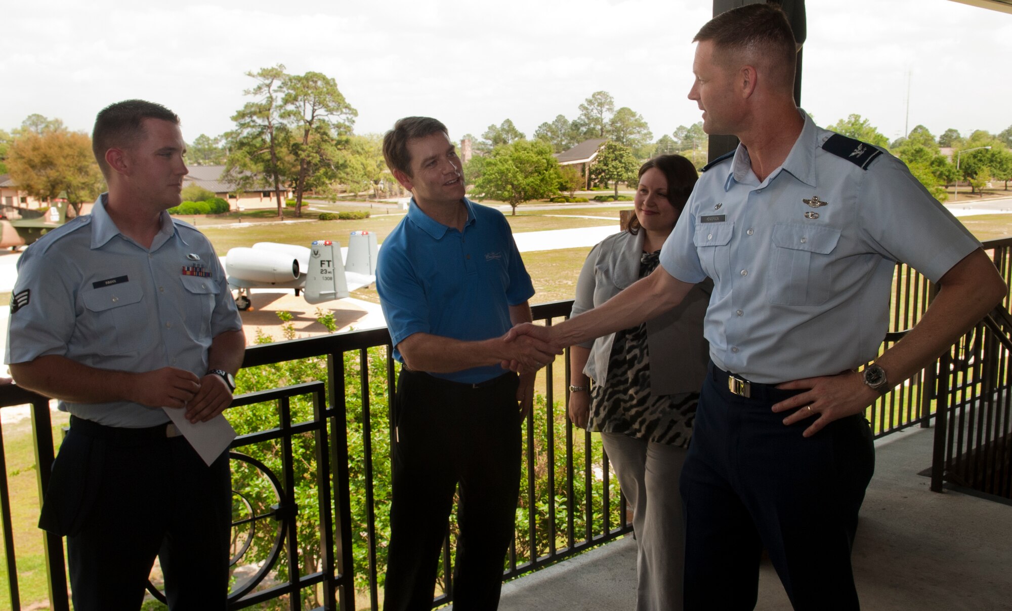 MOODY AIR FORCE BASE, Ga. -- Col. Gary Henderson, 23rd Wing commander, shakes hands with Tim Keller, community member, after receiving a check on behalf of Sober Ride April 11. The Sober Ride program was formed in 1997 by the Base Advisory Council to support the base's senior leadership to prevent drunk driving tragedies and misfortune among Moody members. (U.S. Air Force photo/Airman 1st Class Douglas Ellis)(RELEASED)
