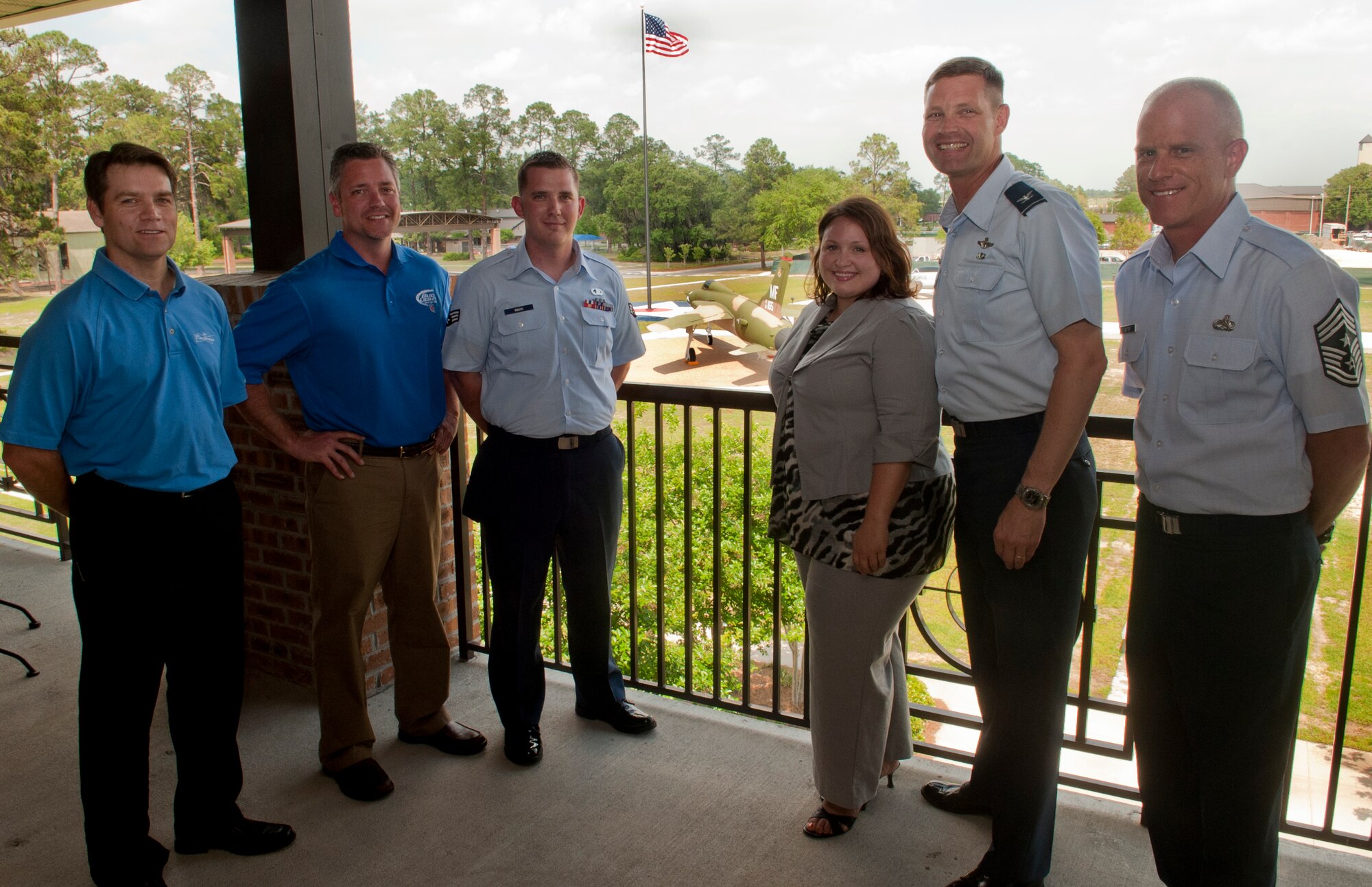 MOODY AIR FORCE BASE, Ga. -- Moody and community members pose for a photograph during a check presentation April 11. The donation was given to help fund Sober Ride, a program designed to prevent drunk driving and serve as back-up when traditional designated driver options are not available. (U.S. Air Force photo/Airman 1st Class Douglas Ellis)(RELEASED)
