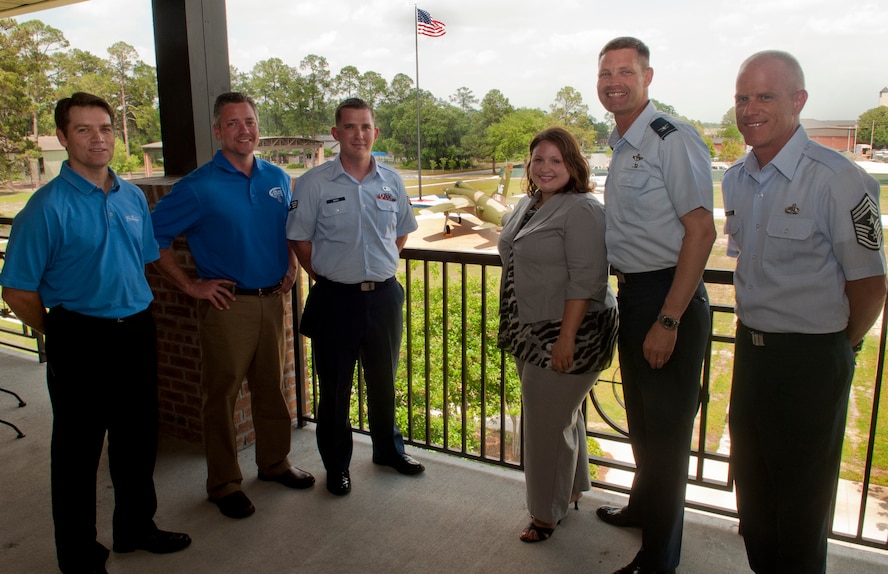 MOODY AIR FORCE BASE, Ga. -- Moody and community members pose for a photograph during a check presentation April 11. The donation was given to help fund Sober Ride, a program designed to prevent drunk driving and serve as back-up when traditional designated driver options are not available. (U.S. Air Force photo/Airman 1st Class Douglas Ellis)(RELEASED)
