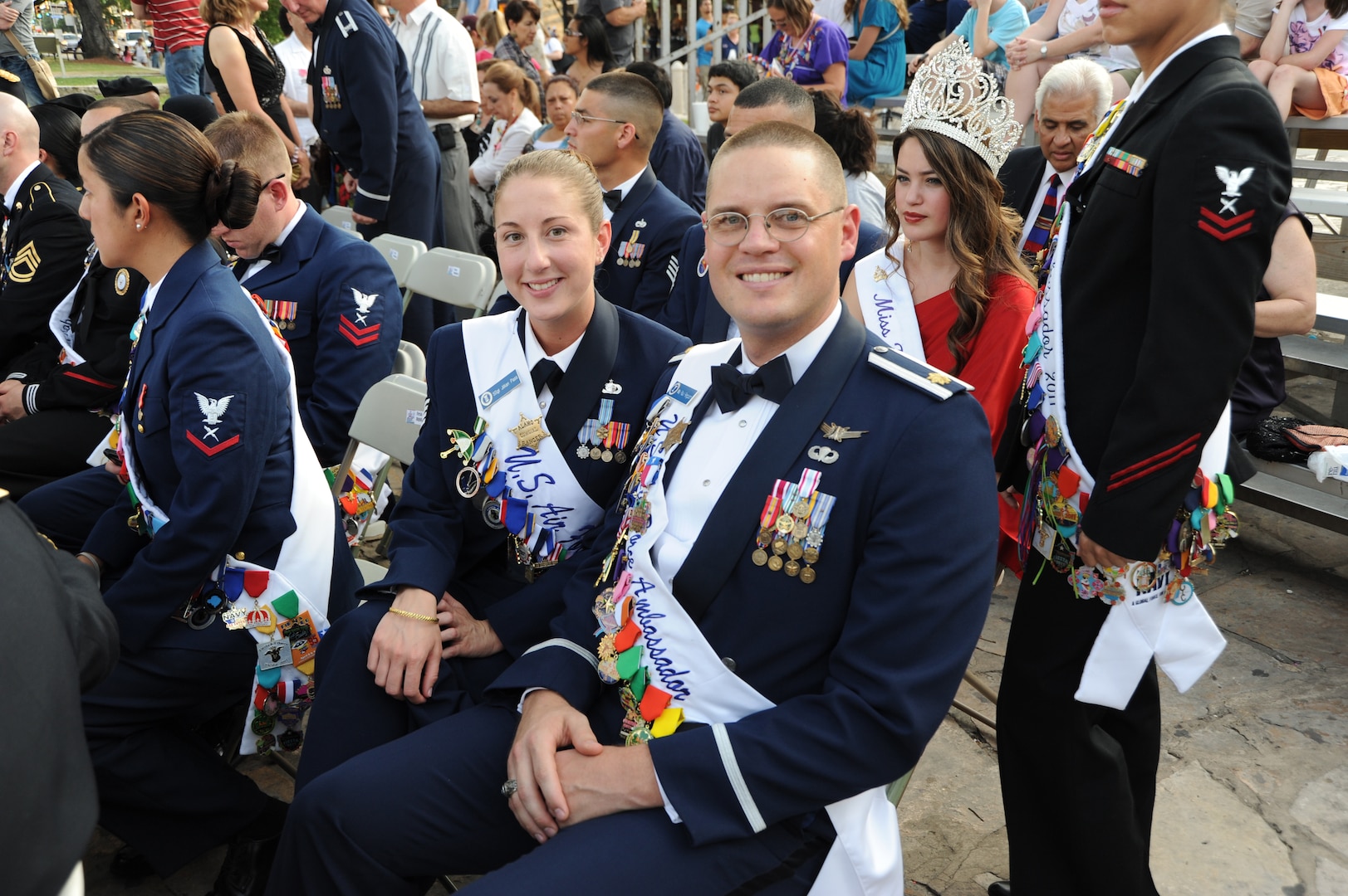 Staff Sgt. Jillian Pass and Maj. Paul Ferguson, Air Force ambassadors, smile for a photo at the Investiture celebration at the Alamo Plaza April 9 during Fiesta 2011. Fiesta is an annual two-week celebration held in San Antonio. (U.S. Air Force photo/Airman Alexis Siekert)