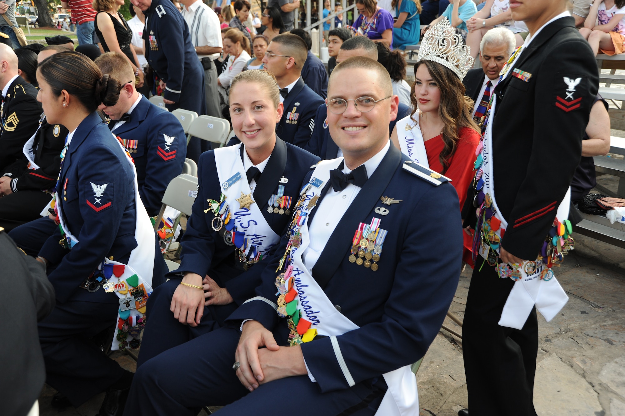 Staff Sgt. Jillian Pass and Maj. Paul Ferguson, Air Force ambassadors, smile for a photo at the Investiture celebration at the Alamo Plaza April 9 during Fiesta 2011. Fiesta is an annual two-week celebration held in San Antonio. (U.S. Air Force photo/Airman Alexis Siekert)
