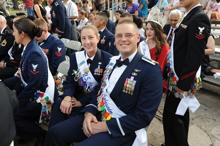 Staff Sgt. Jillian Pass and Maj. Paul Ferguson, Air Force ambassadors, smile for a photo at the Investiture celebration at the Alamo Plaza April 9 during Fiesta 2011. Fiesta is an annual two-week celebration held in San Antonio. (U.S. Air Force photo/Airman Alexis Siekert)