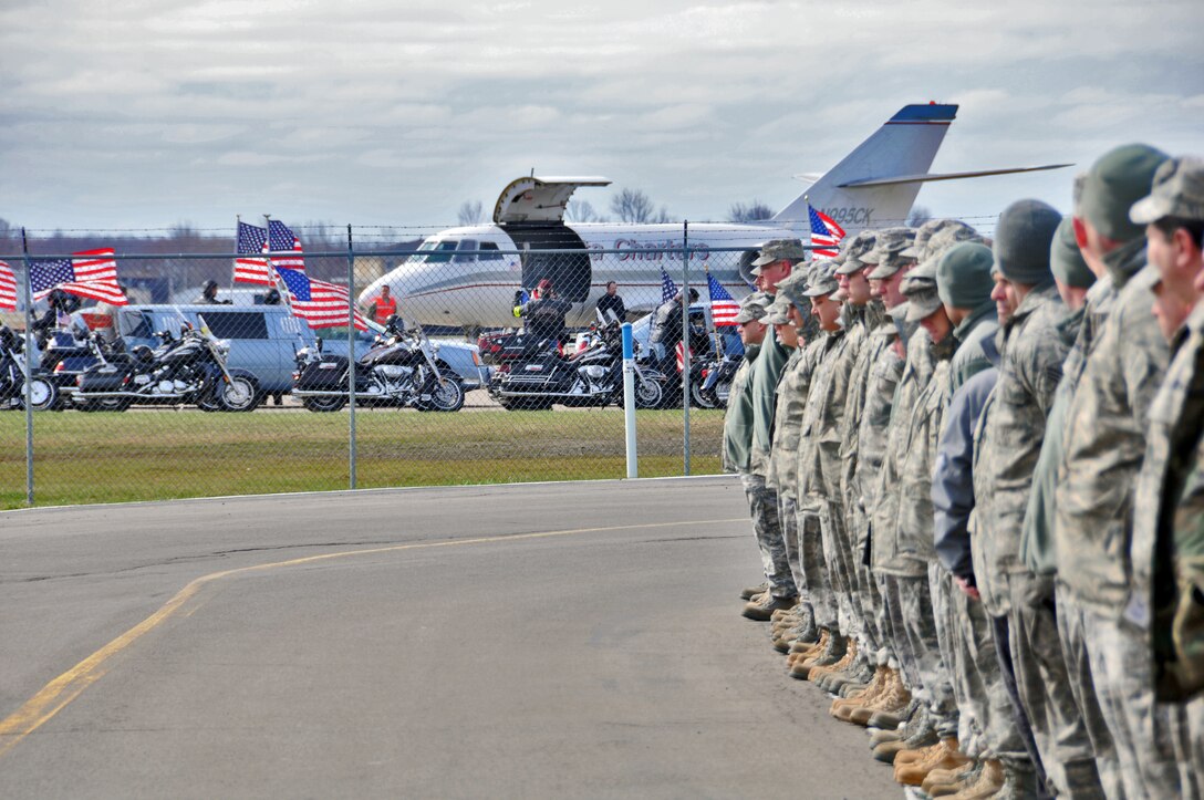 Members of the Niagara Falls Air Reserve Station pay respects to Army Staff Sgt. Michael Lammert 1st Battalion, 84th Field Artillery Regiment, 170th Infantry Brigade Combat Team, April 12, 2011, Niagara Falls, NY. Sgt. Lammert a Tonawanda native, husband and father of two young children gave his life defending his country during his third tour of duty. (U.S. Air Force photo by Staff Sgt. Joseph McKee)