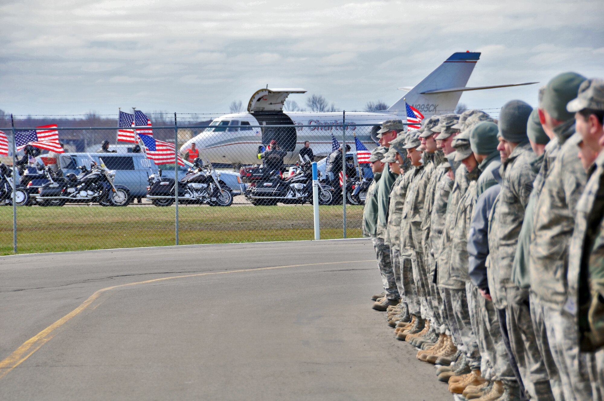 Members of the Niagara Falls Air Reserve Station pay respects to Army Staff Sgt. Michael Lammert 1st Battalion, 84th Field Artillery Regiment, 170th Infantry Brigade Combat Team, April 12, 2011, Niagara Falls, NY. Sgt. Lammert a Tonawanda native, husband and father of two young children gave his life defending his country during his third tour of duty. (U.S. Air Force photo by Staff Sgt. Joseph McKee)