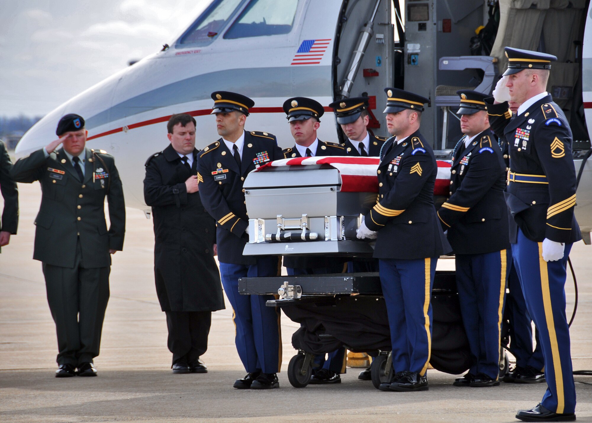 Members of the Niagara Falls Air Reserve Station pay respects to Army Staff Sgt. Michael Lammert 1st Battalion, 84th Field Artillery Regiment, 170th Infantry Brigade Combat Team, April 12, 2011, Niagara Falls, NY. Sgt. Lammert a Tonawanda native, husband and father of two young children gave his life defending his country during his third tour of duty. (U.S. Air Force photo by Staff Sgt. Joseph McKee)