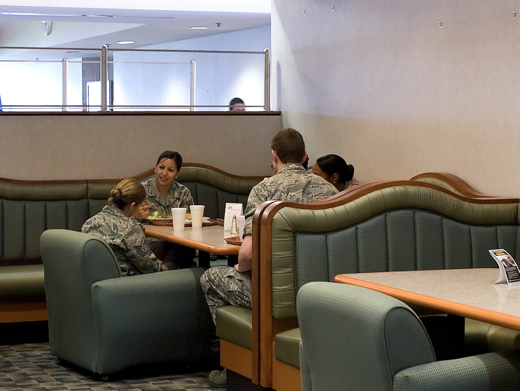 Team Dover members enjoy the new lounge atmosphere of one of four renovated sections of the Patterson Dining Facility April 12, 2012. All four areas were renovated with different décor. The renovation was completed with more than $350,000 from a Comprehensive Airmen Fitness grant. (U.S. Air Force photo by Adrian Rowan)