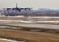 MINOT AIR FORCE BASE, N.D. -- A B-52H Stratofortress lands after a five month deployment to Andersen AFB, Guam, here April 7. Team Minot’s 69th Bomb Squadron and 5th Bomb Wing personnel deployed to Andersen AFB last November in support of U.S. Pacific Command’s Continuous Bomber Presence. This was the 69th BS' first deployment since it’s reactivation in September 2009 and the first major combat deployment of aircraft and personnel since World War II. (U.S. Air Force photo/Staff Sgt. Keith Ballard)
