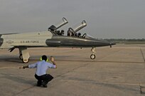 Mac Capistan, 12th Flying Training Wing maintance directorate, marshals T-38 Talon for take off. Maintance workers at Randolph prepare and launch a large variety of aircraft daily. (U.S. Air Force photo/Airman Alexis Siekert)