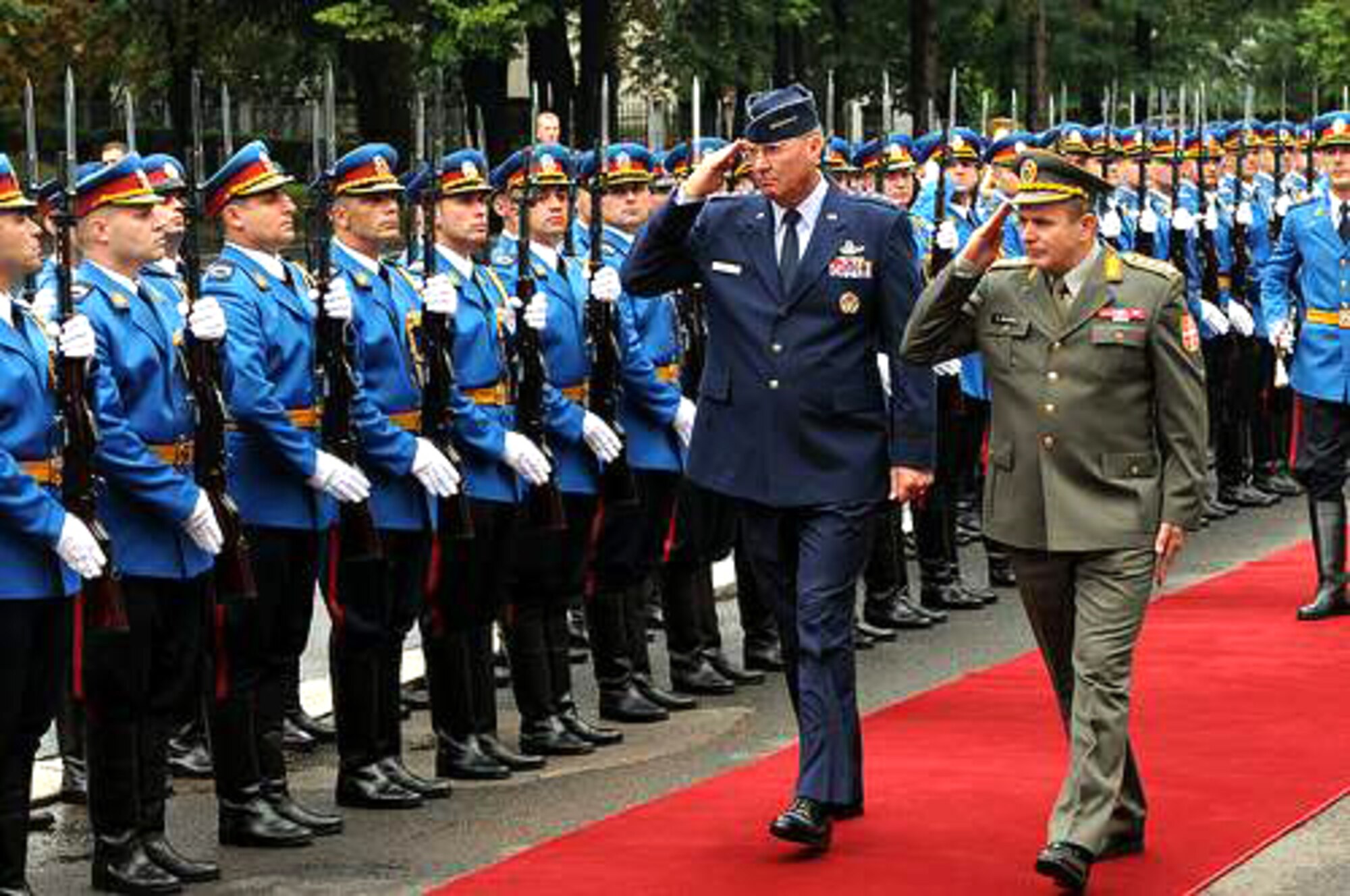 Gen. Craig McKinley and Serbian Army Lt. Gen. Miloje Miletic review Serbian troops Sept. 10, 2010, in Belgrade, Serbia, for National Guard State Partnership Program activities. General McKinley is the chief of the National Guard Bureau, and General Miletic is the chief of staff of the Serbian Armed Forces. (U.S. Army photo/Staff Sgt. Jim Greenhill)