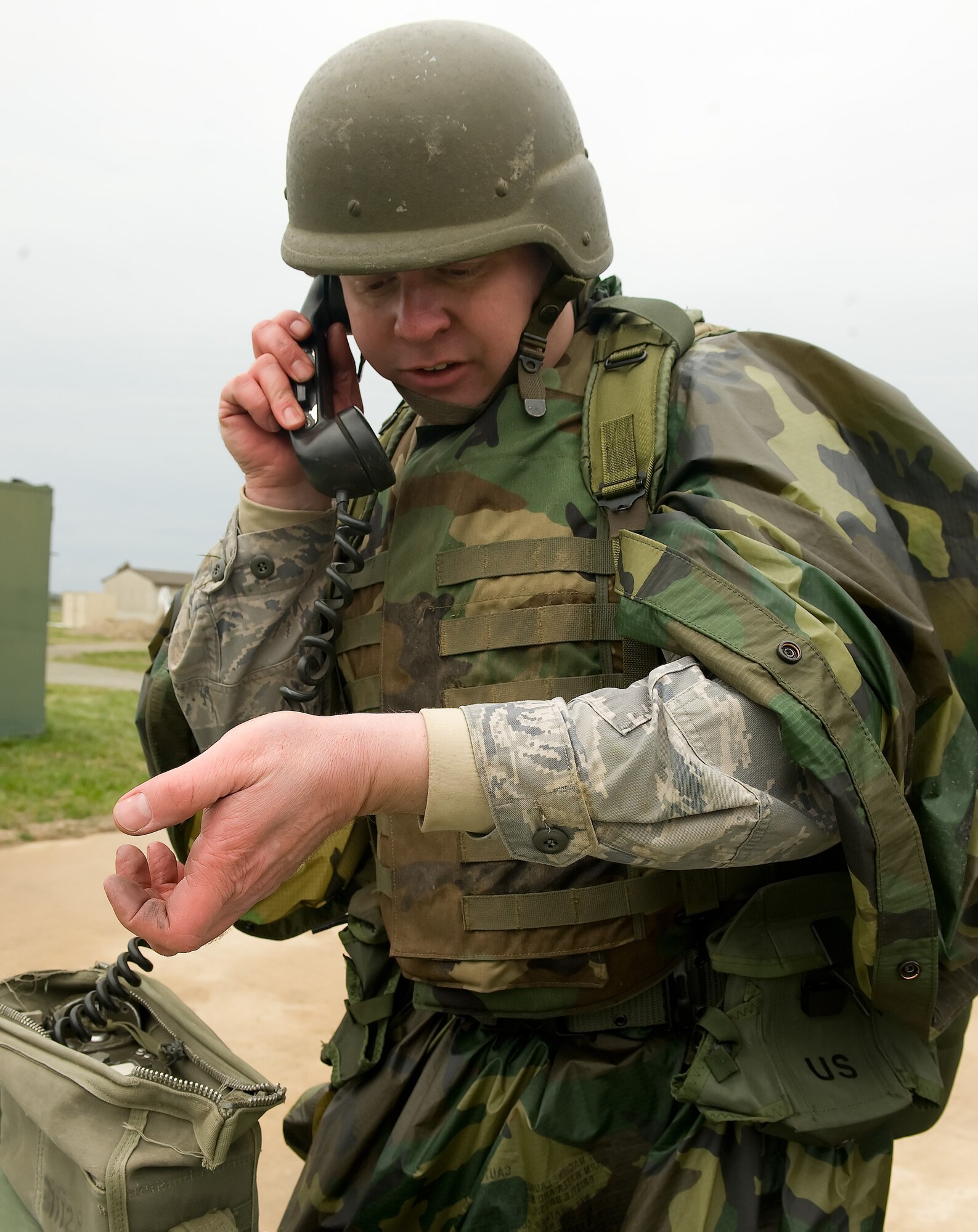 Tech. Sgt. Erick Delsite, 436th Maintenance Squadron, executes a S-A-L-U-T-E report (size, activity, location, unit, time and equipment) of the situation his fire team encountered April 8, 2011 in Base X at Dover Air Force Base, Del.  This was part of Expeditionary Combat Skills Training, which is a prerequisite for deployment.   (U.S. Air Force photo by Steve Kotecki)