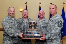 BARKSDALE AIR FORCE BASE, La. -- The 91st Operations Group and the 91st Operations Support Squadron was named the best Intercontinental Ballistic Missile Operation Support Squadron for 2010 here, March 24. Accepting the trophy is (pictured left to right) Lt. Gen. James Kowalski, Air Force Global Strike Command commander, Col. Fred Stoss, 91st Missile Wing commander, Chief Master Sgt. John Hoffman, 91st MW command chief and Chief Master Sgt. Brian Hornback, AFGSC command chief. (U.S. Air Force photo/ Senior Airman Joanna M. Kresge)